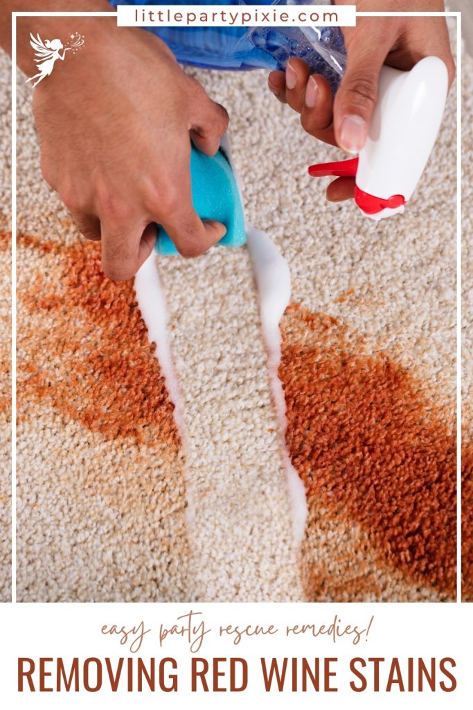 hands with spray bottle and wipe cleaning a red wine stain off carpet