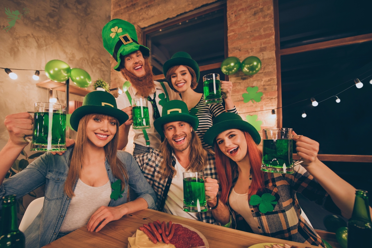 a groip of adults celebrating st patricks day at home with festive hats and green drinks