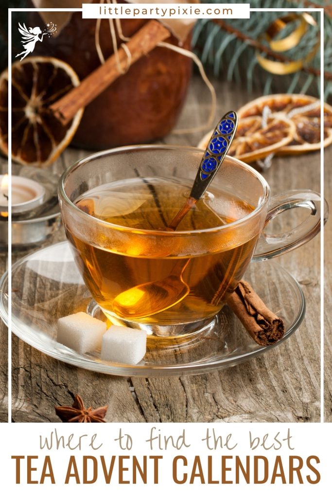 Glass cup of tea with cinnamon, sugar cubes, and decorations
