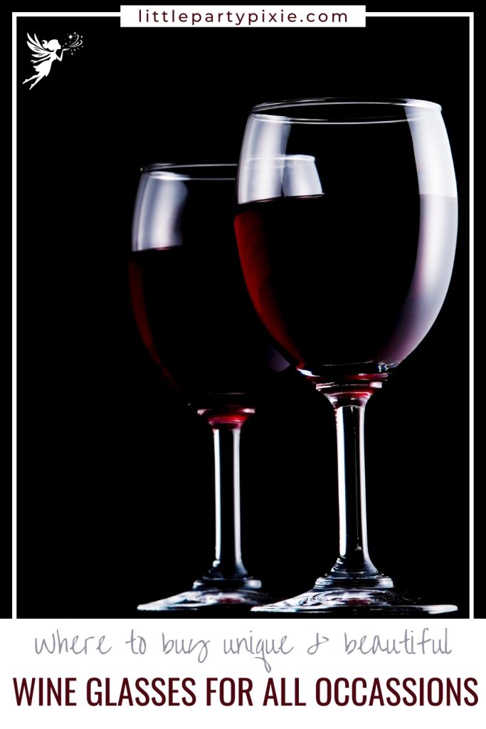 Two elegant wine glasses filled with red wine against darkness