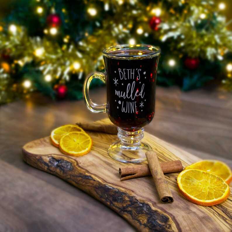 Personalized Christmas mulled wine glass with cinnamon sticks and dried oranges