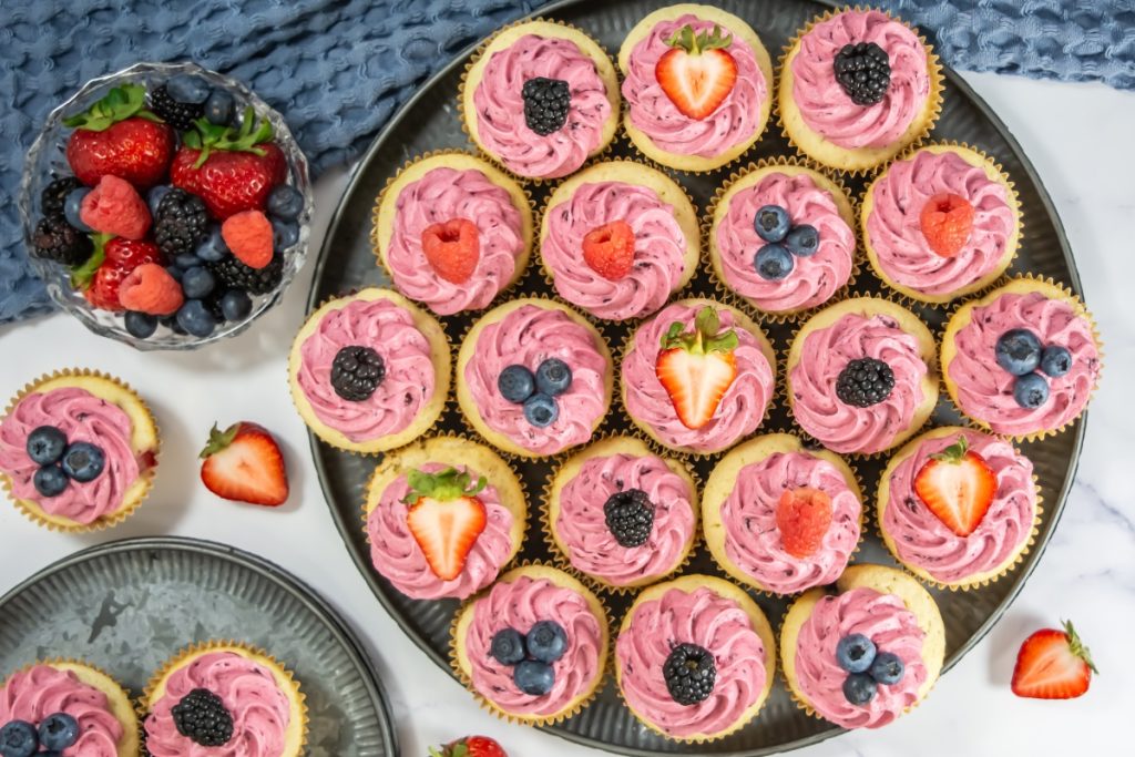 Process image for making mixed berry cupcakes - finished mixed berry cupcakes served in round platter