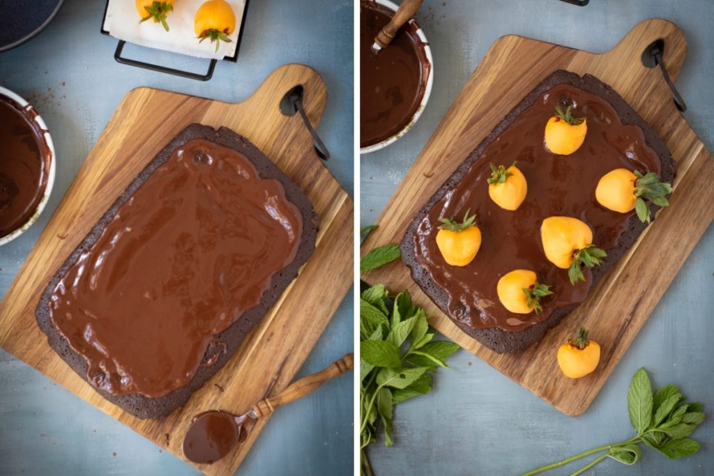 Process image for making Chocolate Pumpkin Patch Brownie Cake - spread chocolate ganache on cake then placing dipped strawberries on top
