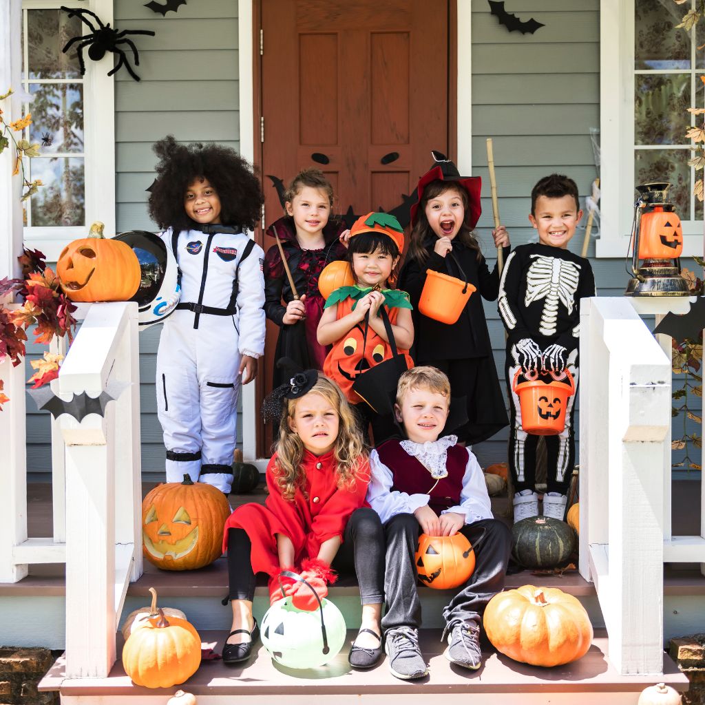cute kids wearing a variety of halloween costumes