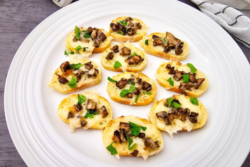 Mushroom Crostini served in a white round platter
