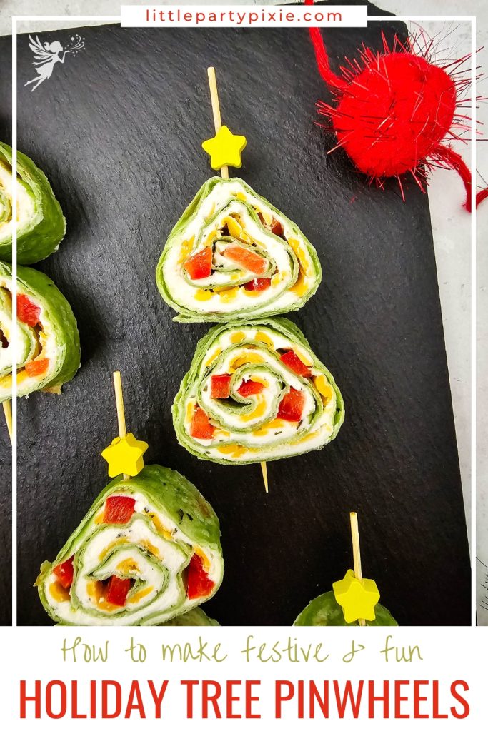 festive pinwheels on black slate- a savory appetizer dish in the shape of a christmas tree