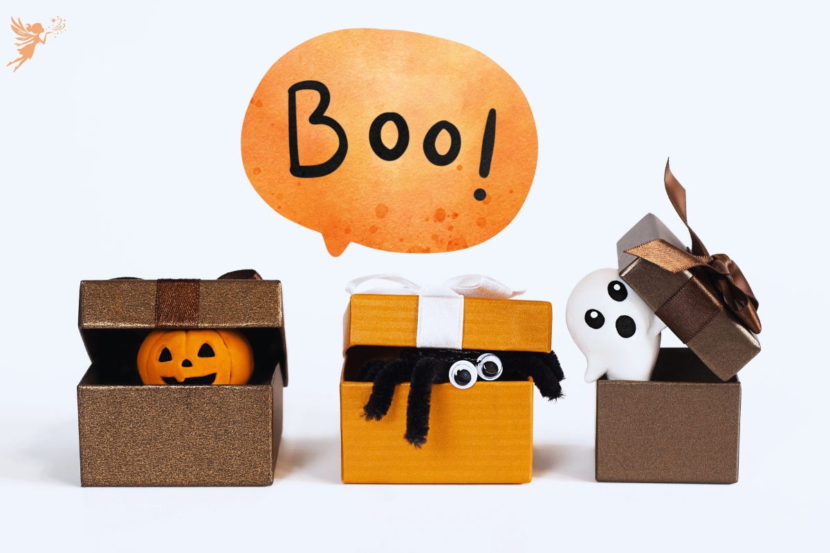 cute halloween chaaracters poking out of boxes with a large speech bubble boo