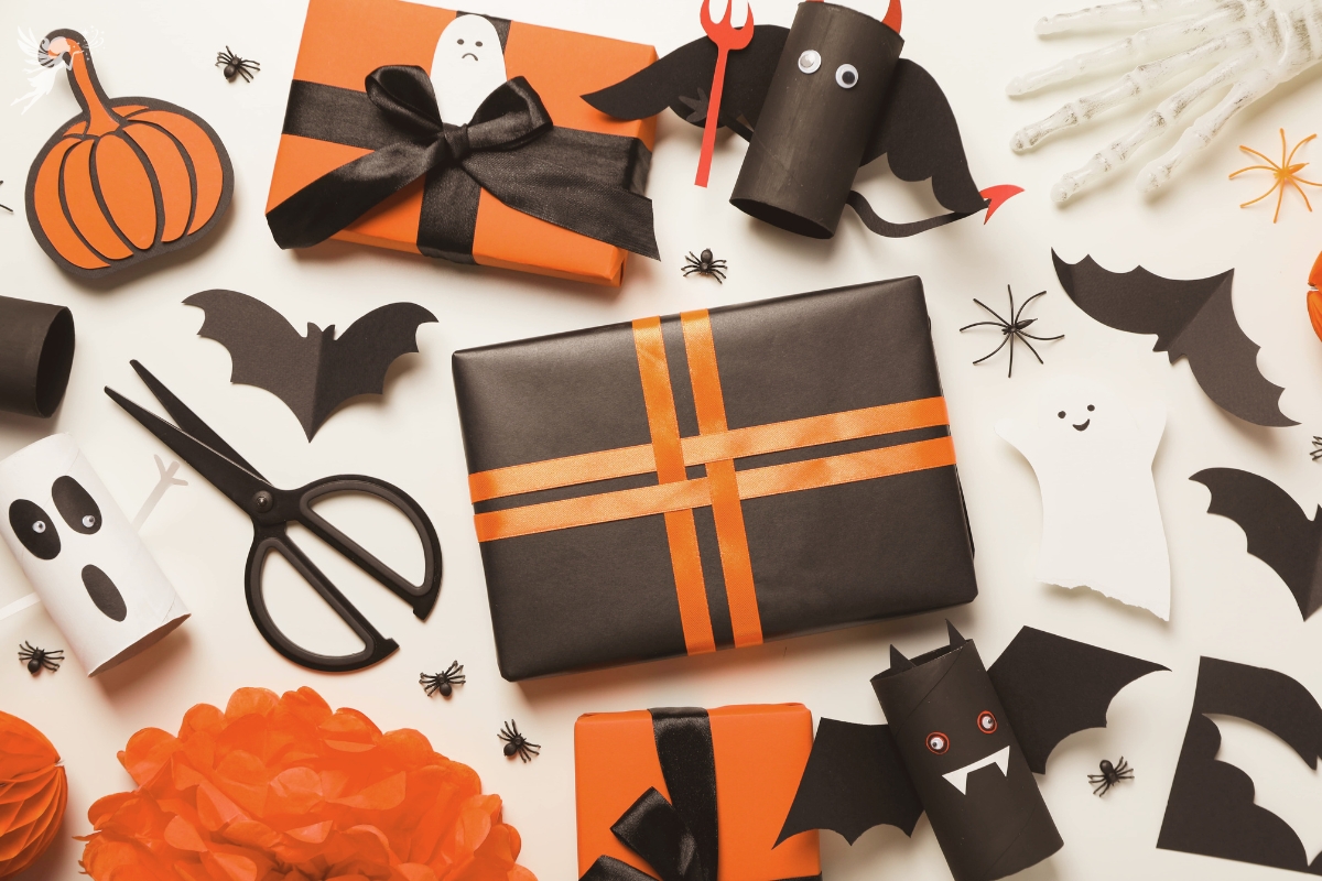a flat lay display of black and orange halloween gift wrapped packages