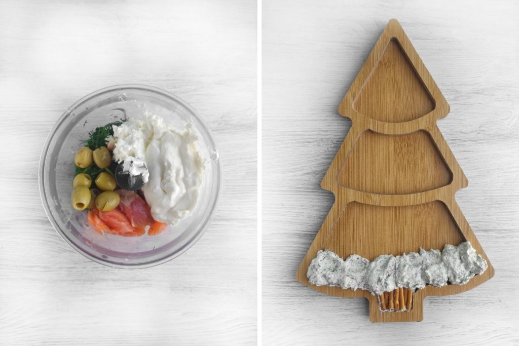 A clear bowl holds dip ingredients including salmon, olives, and cream cheese. A tree-shaped wooden board is layered with the creamy salmon dip.
