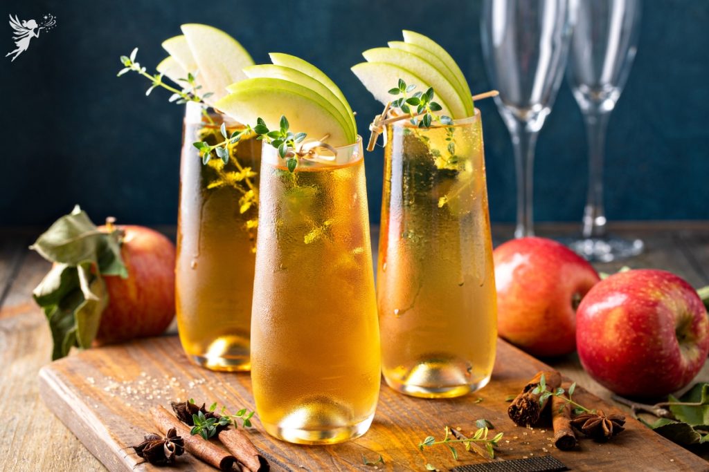 apple cider mimosa in stemless glasses