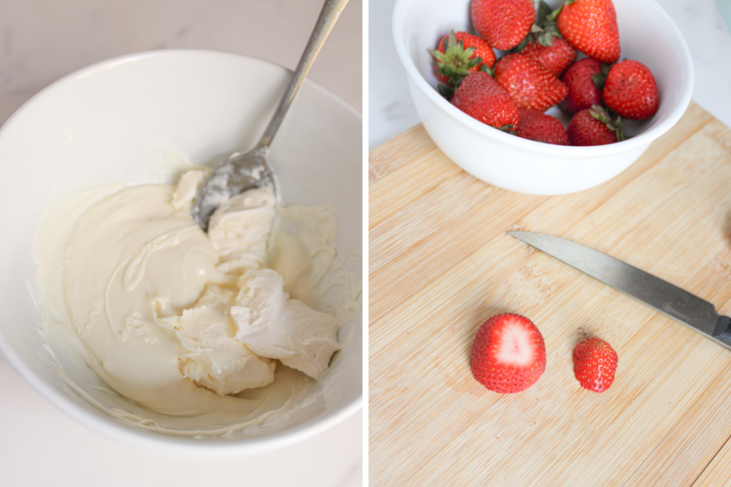 Whipped cream cheese and melted white chocolate are mixed in a bowl. Fresh strawberries are prepped on a wooden cutting board.