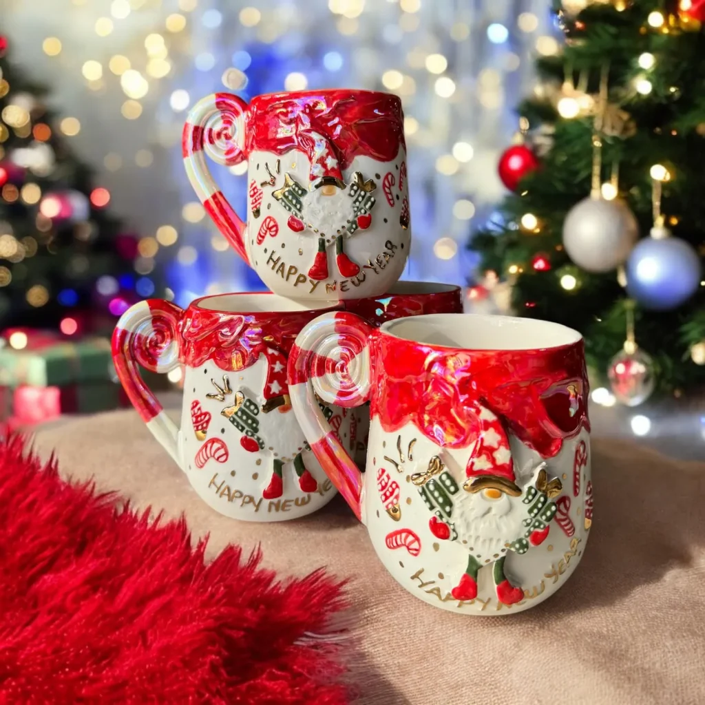 three stacked ceramic christmas mugs