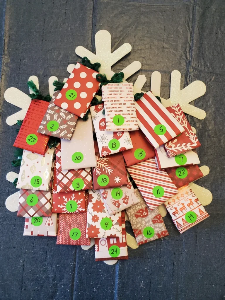 homemade snowflake advent with numbered envelopes of tea
