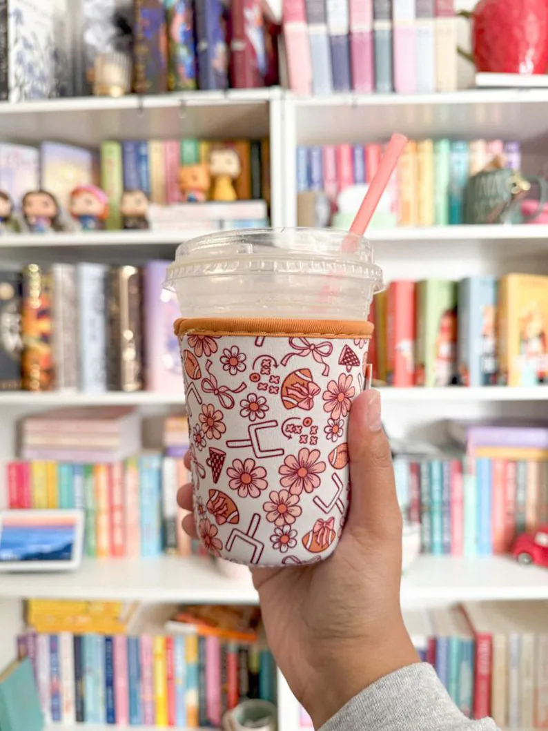 floral and football drink sleeve held in front of girl shelf on etsy