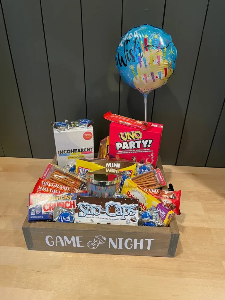 Game Night Box full of assorted treats and board games for a puzzle loving family Etsy