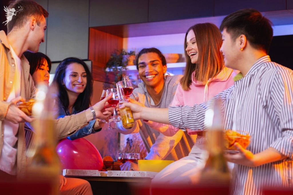 adults clinking glasses at a house party