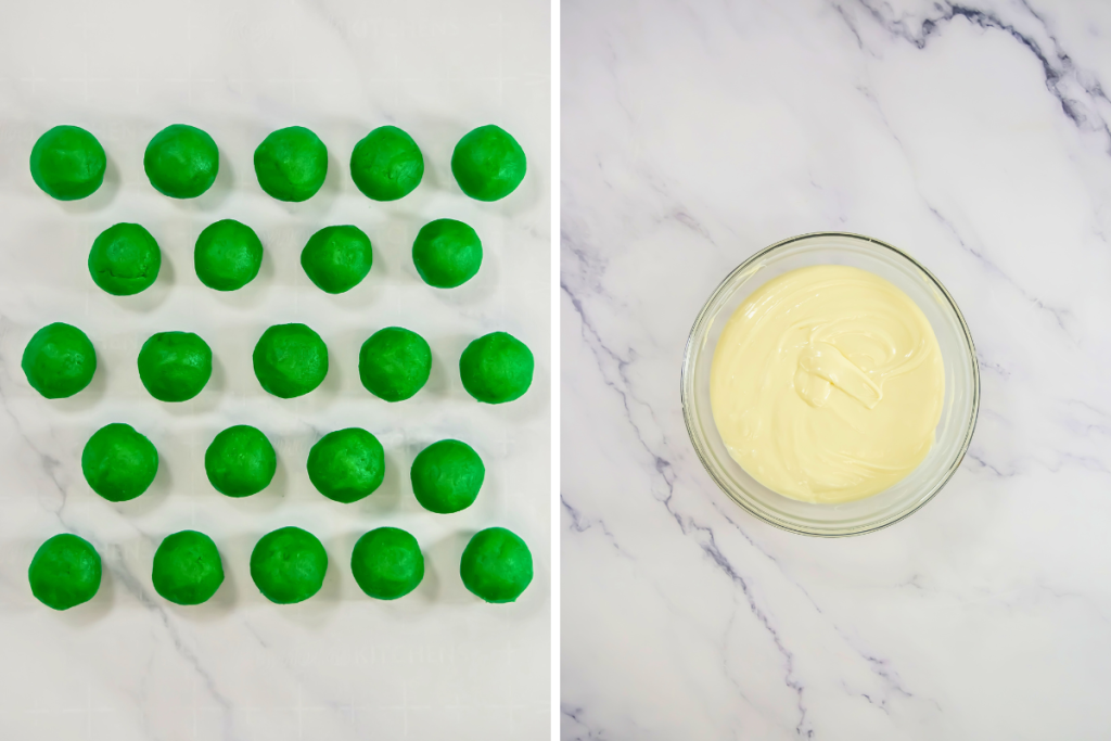 Uniformly rolled green cake dough balls ready for dipping, next to a bowl of melted white chocolate coating for the St Patrick's Day Cake Balls.