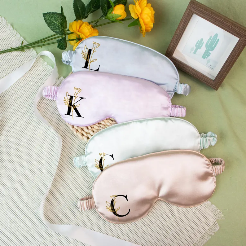 Four personalized satin sleep masks in soft pastel colors with floral initial designs, chic Teen Party Favors. Etsy
