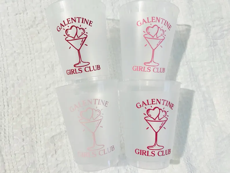 A stack of frosted plastic cups printed with a pink "GALENTINE GIRLS CLUB" graphic, reusable Galentine's Day Party Favors drinkware.