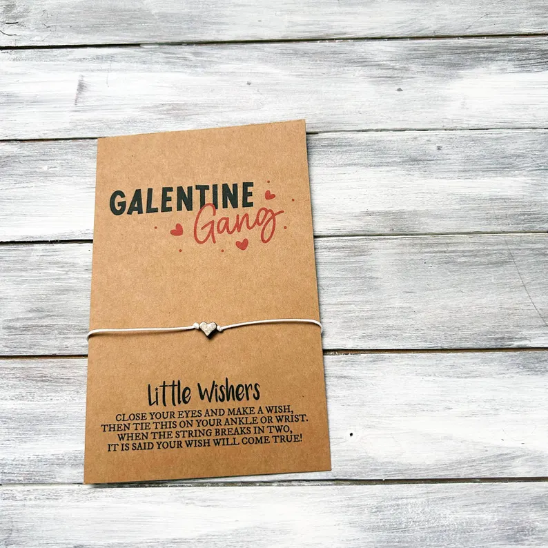 A "Little Wishers" wish bracelet with a silver heart charm on a "Galentine Gang" card, perfect as a small Galentine's Day Party Favor. Etsy