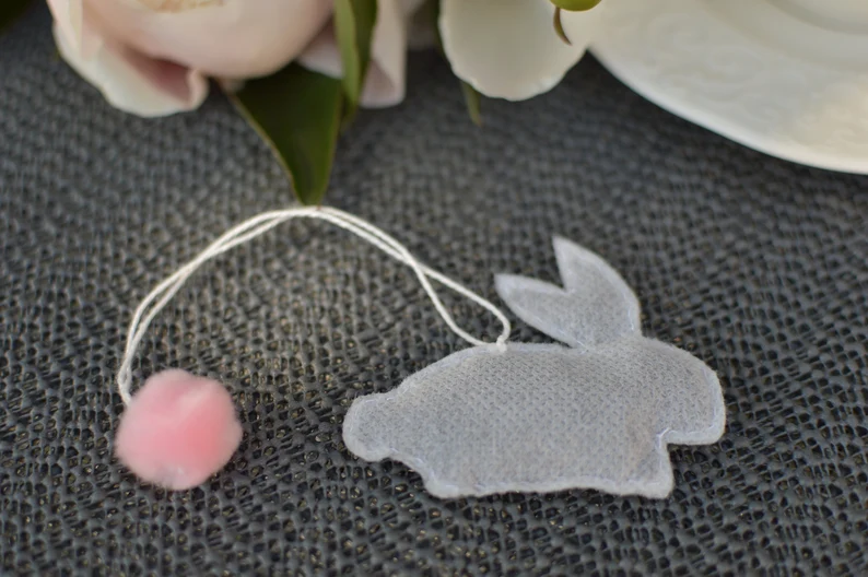 Whimsical bunny-shaped tea bags with a soft pink pom-pom detail, perfect for tea lovers and cozy Adult Easter Baskets.