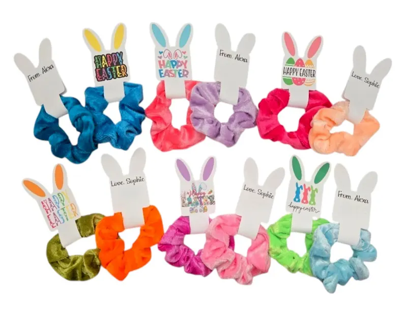 Colorful velvet hair scrunchies featuring personalized bunny ear gift tags, ideal for custom Easter Party Favors Kids goody bags.