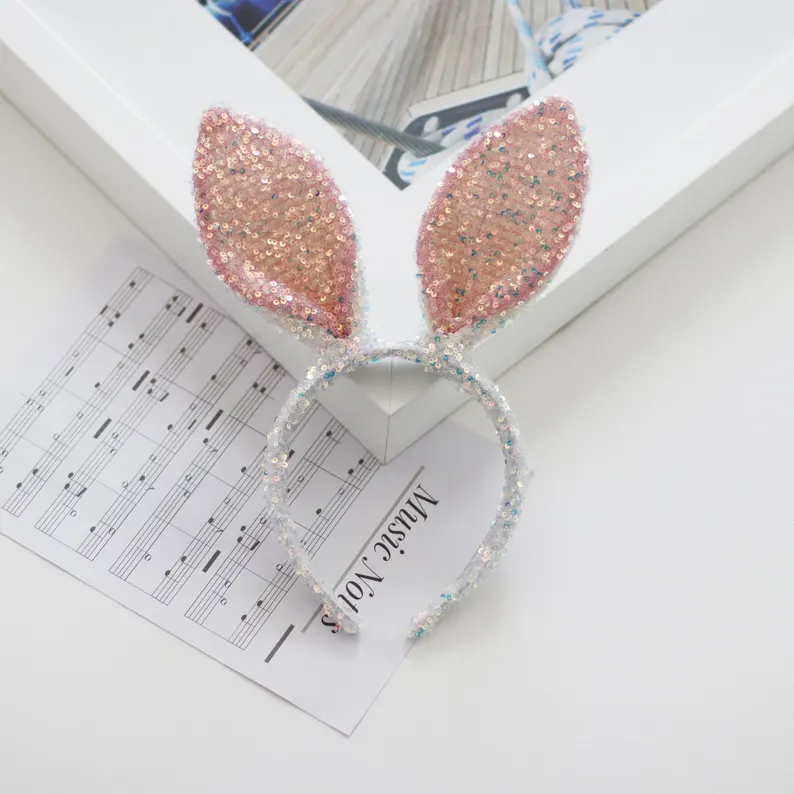 Shimmering pink and silver sequin bunny ear headband, a festive and sparkly accessory for Easter Party Favors Kids celebrations.