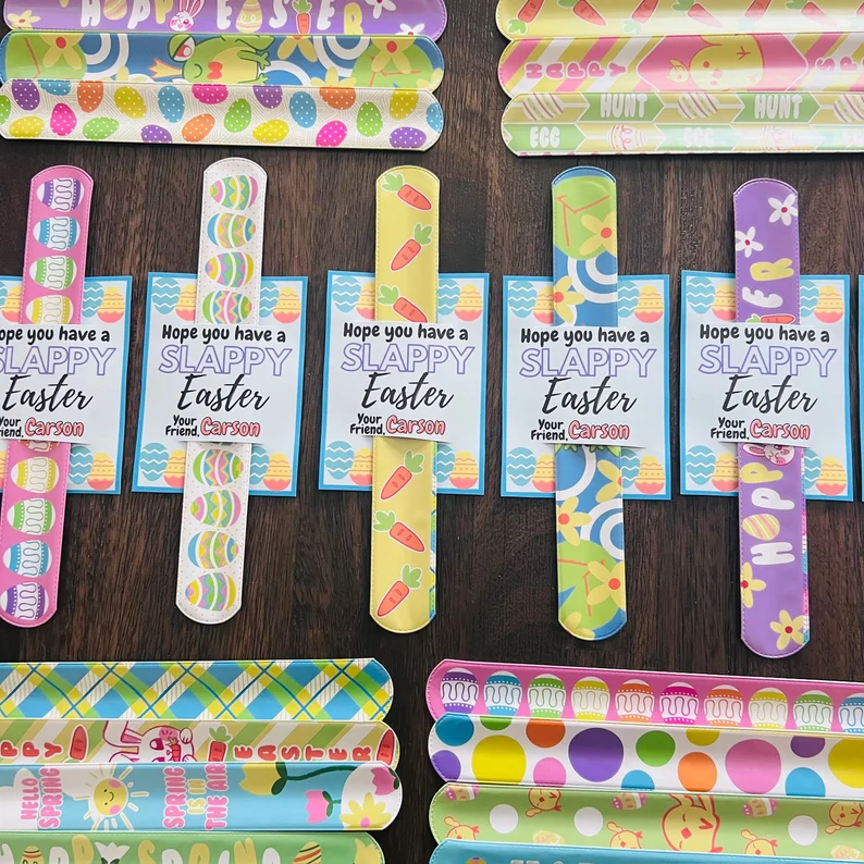 Assorted colorful Easter-themed slap bracelets with personalized gift cards, a classic and popular choice for Easter Party Favors Kids.