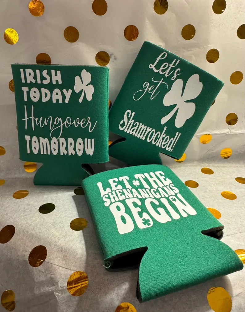 Three green neoprene drink coolers with white festive slogans, serving as practical and fun St. Patrick's Day favors.