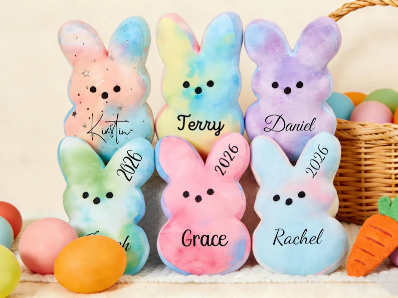 Soft, tie-dye personalized bunny plushies featuring custom names and "2026," making them adorable and unique Easter Party Favors Kids will treasure.