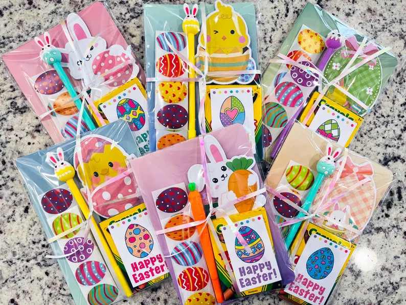 Individual cellophane packs with bunny pens, coloring books, and stickers for easy-to-hand-out Easter Party Favors Kids.