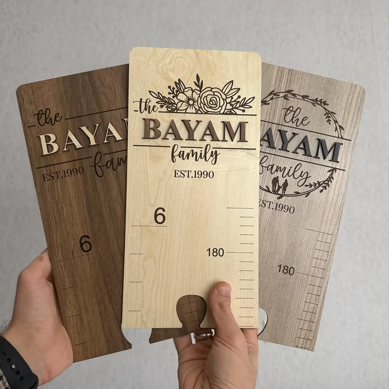 sample wooden growth charts engraved with family name