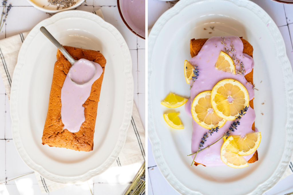A finished lemon lavender pound cake topped with thick purple lavender glaze, garnished with fresh lemon slices and dried floral sprigs.
