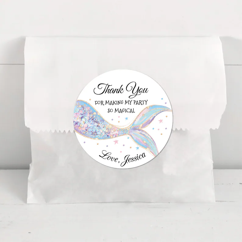 White favor bag with glitter mermaid tail sticker reading "thank you for making my party magical," perfect mermaid party favors packaging solution.