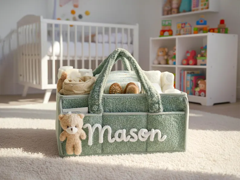 Sage green personalized diaper caddy organizer with the name Mason filled with baby essentials and a teddy bear, practical baby shower gifts for new parents. Etsy