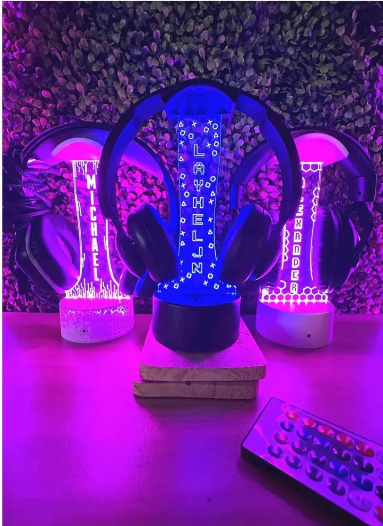 Personalized LED headphone stands with glowing name displays in purple and blue, unique tween teen boy party favors for gaming enthusiasts. Etsy
