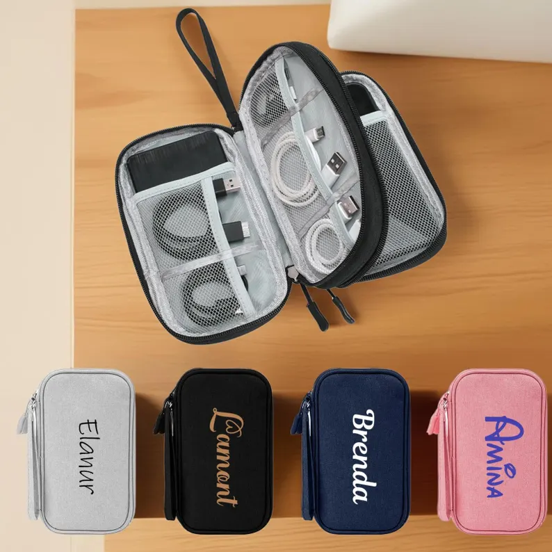 Personalized tech storage bags in gray, black, navy, and pink with custom names, practical tween teen boy party favors for organizing cables and accessories.