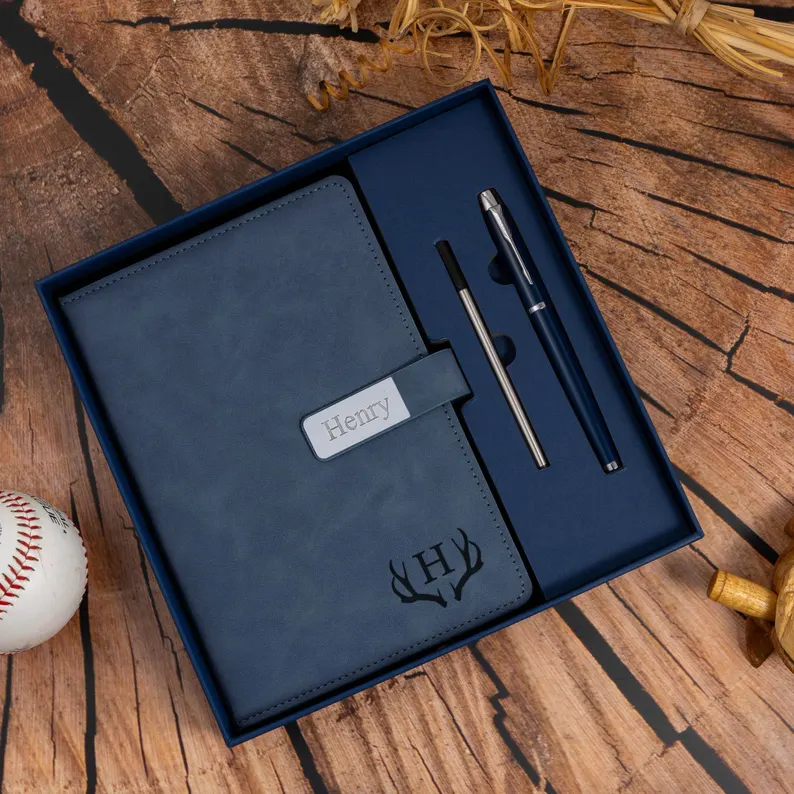 Personalized leather journal set with matching pens makes sophisticated male teacher appreciation gifts, featuring custom name plate and monogrammed antler design in navy. Etsy
