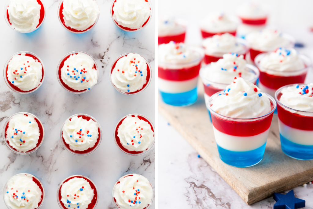 Finished non-alcoholic red, white & blue jello shots topped with whipped cream and patriotic sprinkles displayed on marble surface and wooden board.