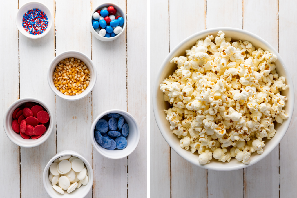 Ingredients for red white and blue patriotic popcorn including popcorn kernels, candy melts, M&Ms, and sprinkles with bowl of fresh popped popcorn.