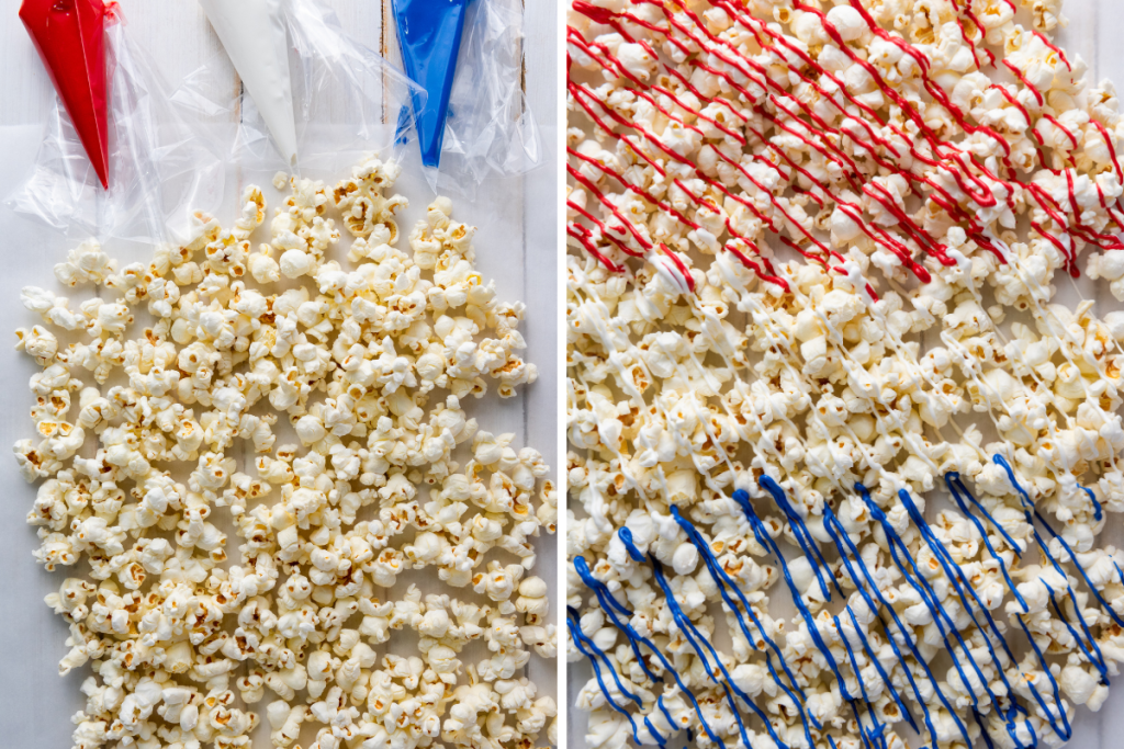 Popped popcorn spread on parchment with red and blue candy being drizzled over to make red white and blue patriotic popcorn.