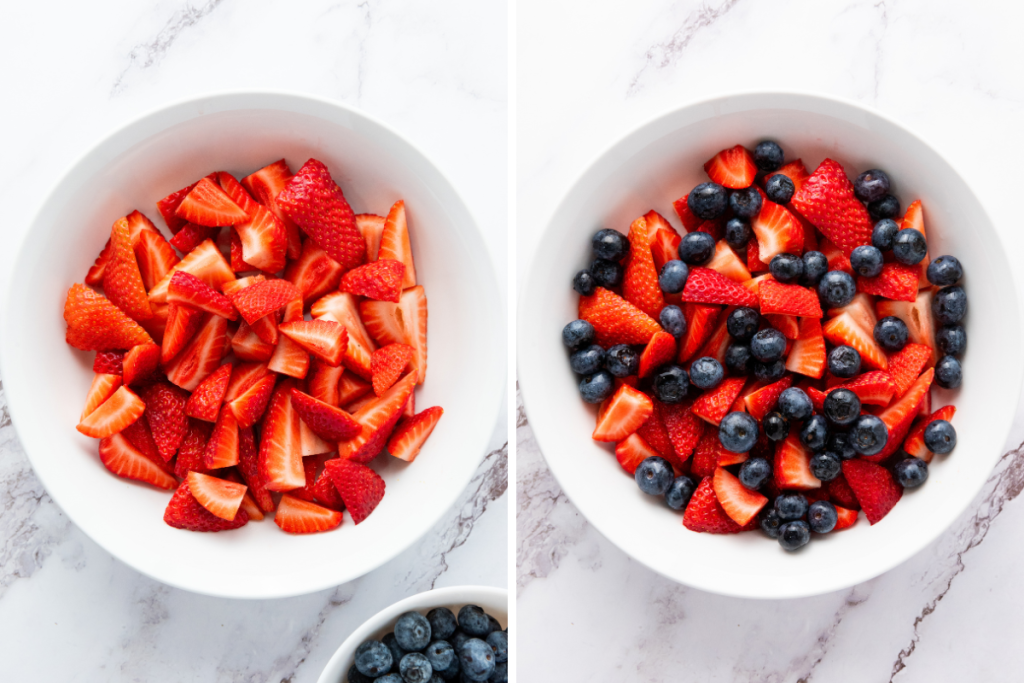 Making star spangled fruit salad by placing quartered strawberries in white bowl, then adding fresh blueberries to combine red and blue.