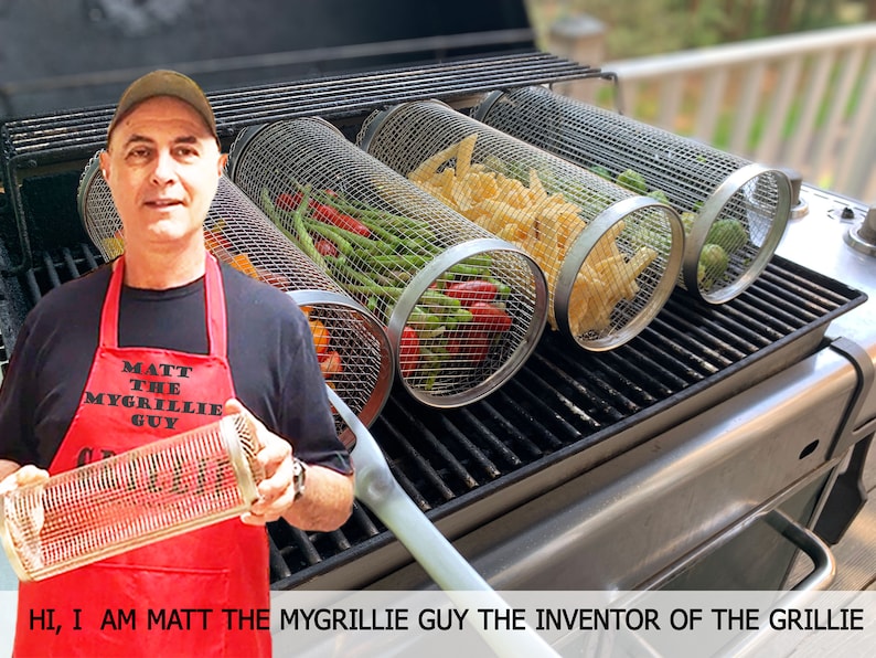 Four cylindrical mesh grilling baskets filled with colorful vegetables including corn, peppers, and zucchini on backyard grill—practical dad grill gifts collection. Etsy