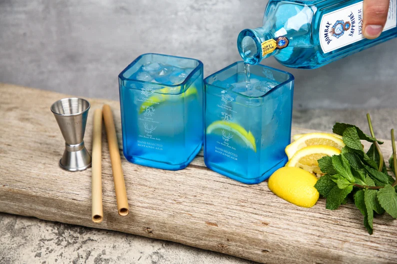 a pair of upcycled and personalized Bombay Sapphire Gin Glasses Etsy