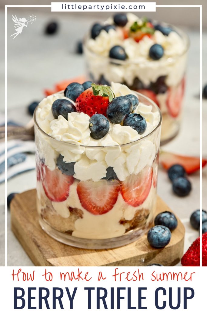 Close up of red white and blue berry trifles in glass cups layered with sliced strawberries, custard, and blueberry topped whipped cream.