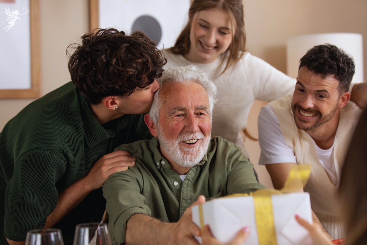 a grandfather surrounded by family receiving a gift