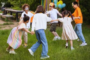 kids playing ring a rosy outside