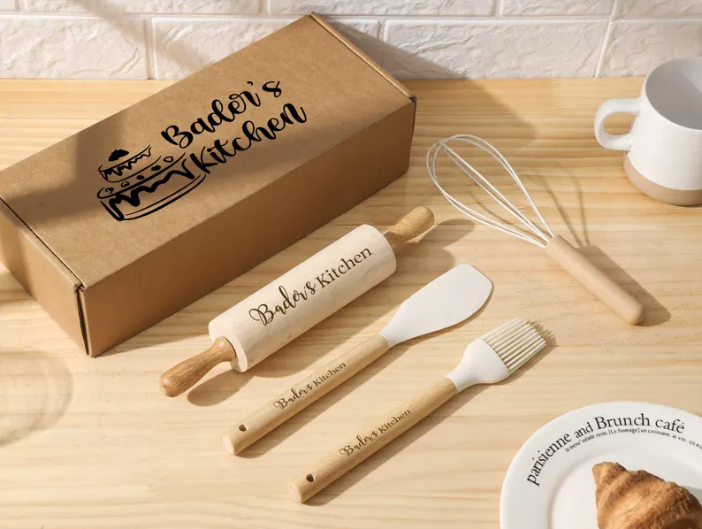 persoanlized message engraved on wood and beige silicone cookware items on a kitchen bench with box etsy mothers day experience gift idea
