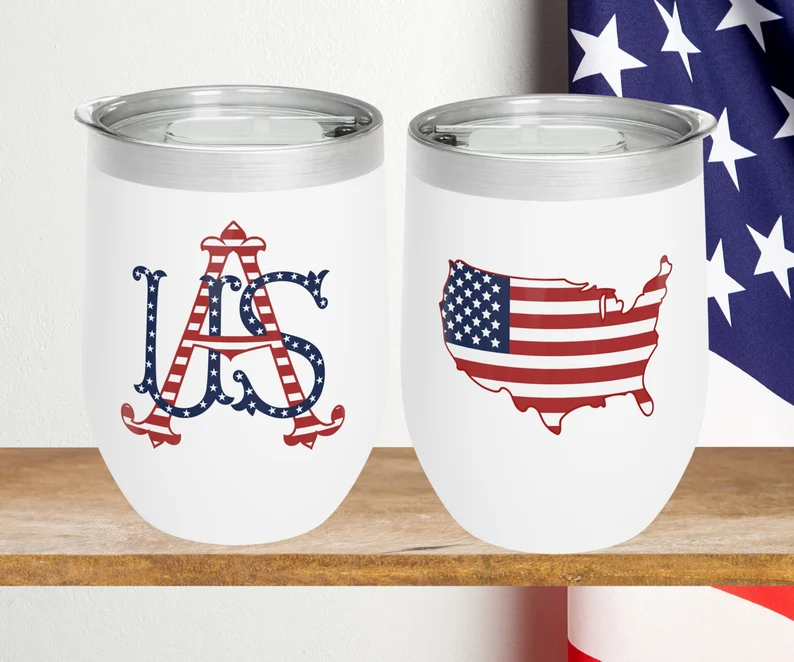 Two white insulated wine tumblers with patriotic USA monogram and flag designs — thoughtful 4th of July hostess gifts for summer celebrations. Etsy