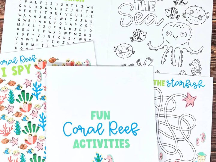 A set of printable coral reef activity sheets including a word search, coloring page, and starfish maze spread on a wooden surface